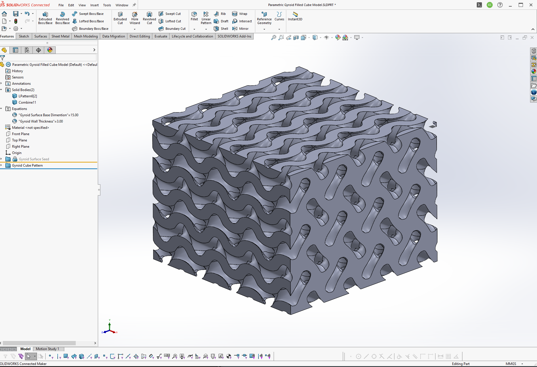 The gyroid surface thickened, trimmed and patterned into a cubic volume.